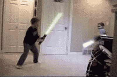 Boy Holding Light Saber GIF