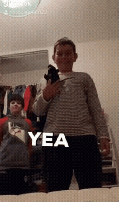 Boy Holding Stuffed Animal Saying Yea GIF