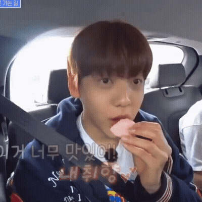 Boy In Back Seat Eating Strawberry GIF