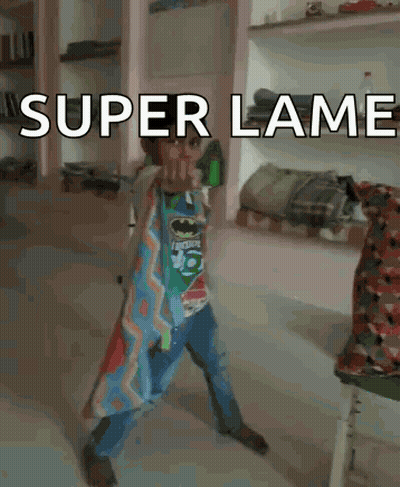 Boy in Batman Shirt with Super Lame Sign