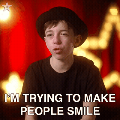 Boy In Black Hat And Shirt Smiling GIF