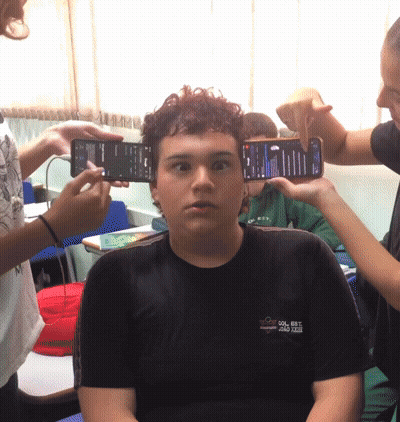 Boy In Black Shirt 'Col Est' Being Photographed GIF