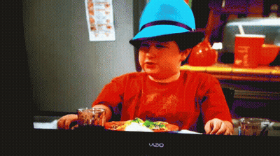 Boy In Blue Hat Sitting At Table With Vizio TV GIF
