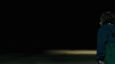 Boy In Blue Jacket Holding Hockey Stick GIF