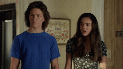Boy in Blue Shirt and Girl in Black and White Dress