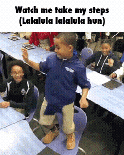 Boy In Blue Shirt Dancing In Classroom GIF