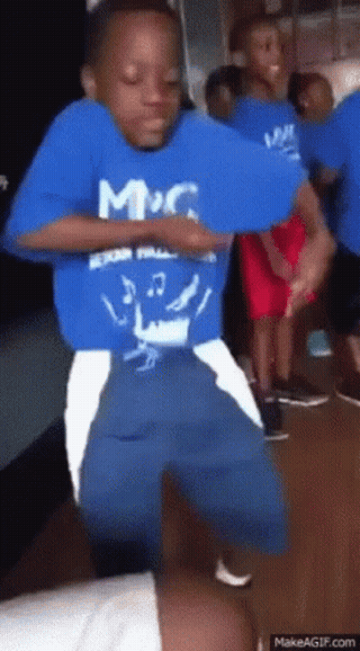 Boy In Blue Shirt Dancing With Children GIF