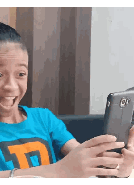 Boy In Blue Shirt Looking At Phone Sticker