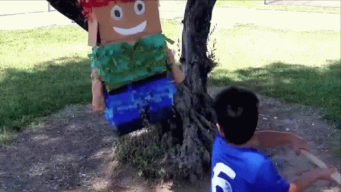 Boy In Blue Shirt Number 69 Next To Cardboard Man GIF
