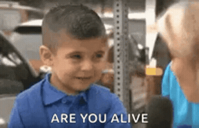 Boy In Blue Shirt Talking To Woman GIF
