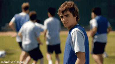 Boy In Blue Vest With Soccer Team GIF