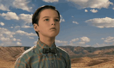 Boy In Bow Tie And Plaid Shirt Looking Up GIF