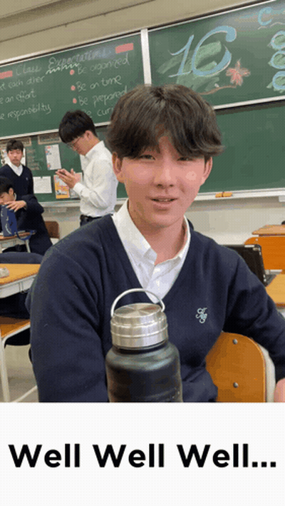 Boy In Classroom With Number 16 GIF
