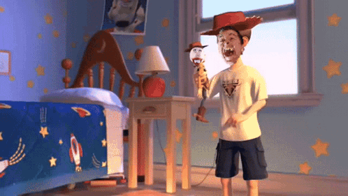 Boy in Cowboy Hat Holding Woody Doll