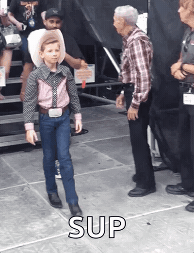 Boy In Cowboy Outfit Next To Man In Plaid Shirt GIF