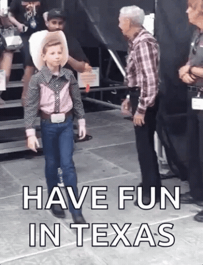 Boy In Cowboy Outfit Next To Man In Plaid Shirt GIF
