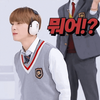 Boy In Ear Muffs Facing Man In Suit With Question Mark GIF
