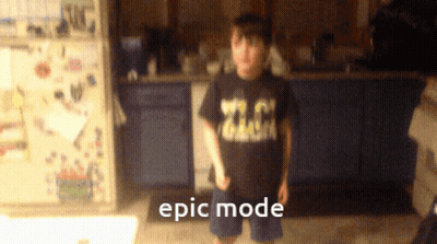 Boy In Epic Mode Shirt In Kitchen GIF