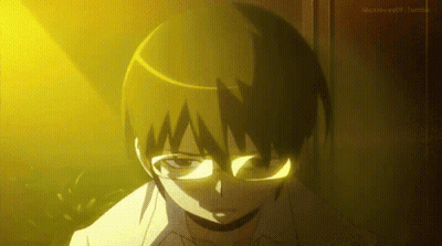 Boy In Glasses Standing Before Yellow Light GIF