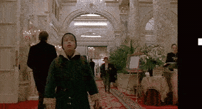 Boy In Green Coat Walking Down Red Carpet GIF