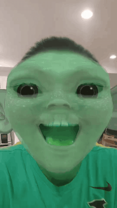 Boy In Green Nike Shirt Making Funny Face GIF