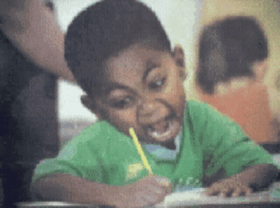 Boy In Green Shirt Writing With Pencil GIF