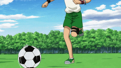 Boy In Green Shorts Kicking Soccer Ball GIF