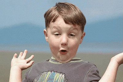 Boy In Grey Mountain Shirt Making Funny Face GIF