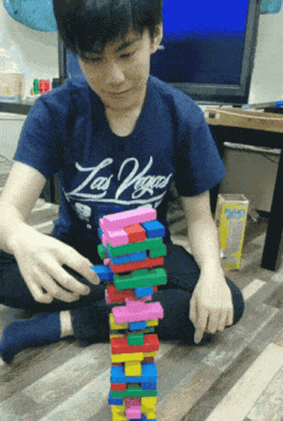 Boy In Las Vegas Shirt Stacks Blocks GIF