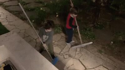 Boy In Mickey Mouse Shirt Sweeping GIF