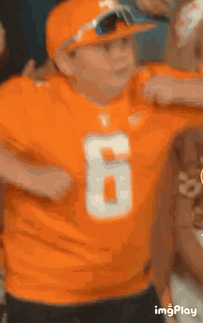 Boy In Orange Shirt And Hat Number 6 GIF