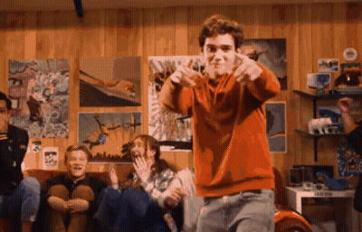 Boy In Orange Sweater Dancing In Front Of Kids GIF