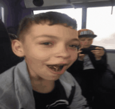 Boy In Oregon Hat Looking At Camera GIF