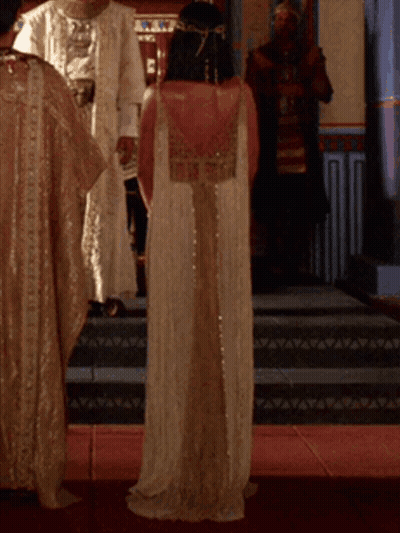 Boy In Pharaoh Costume With Flaming Torches GIF