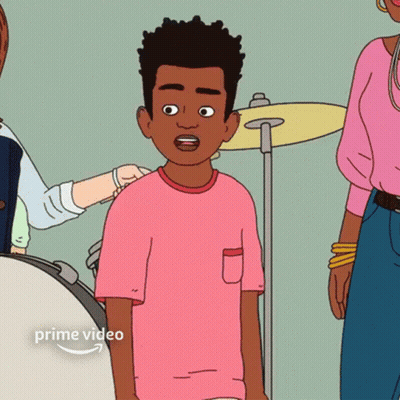 Boy In Pink Shirt Standing In Front Of Drum Set GIF