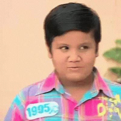 Boy In Plaid Shirt Making Funny Face GIF