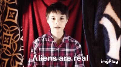 Boy In Plaid Shirt Saying Aliens Are Real GIF