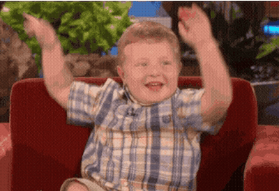 Boy In Plaid Shirt Sitting On Couch GIF