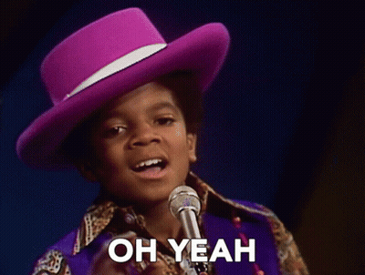 Boy In Purple Hat Singing Into Microphone Saying Oh Yeah GIF
