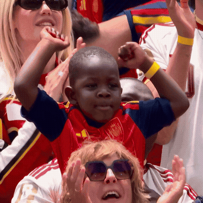 Boy In Red And Blue Jersey With Crown GIF