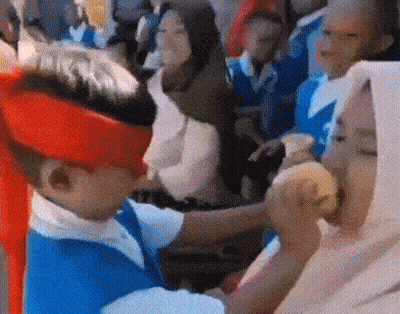 Boy In Red Hat And Blue Shirt Eating Hamburger GIF