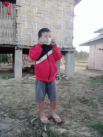 Boy In Red Jacket Holding Dollar Bill GIF