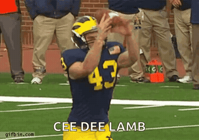 Boy In Red Shirt And Hat Standing By Yellow Wall GIF
