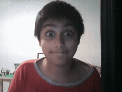 Boy In Red Shirt Making Funny Face GIF