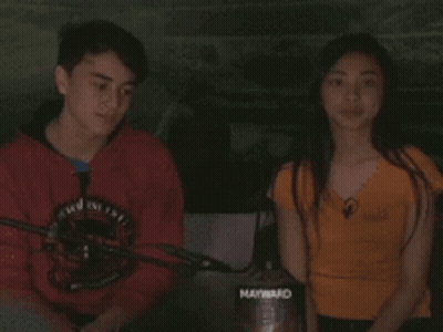 Boy In Red Shirt Talking To Girl In Orange Shirt Holding Maynard Vacuum Cleaner GIF