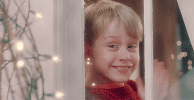 Boy In Red Sweater Smiling Out Window GIF