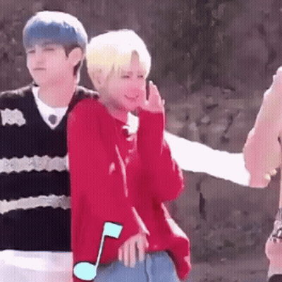 Boy In Red Sweater Standing Next To Boy In Black Sweater GIF