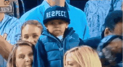 Boy In Respect Hat In Crowd GIF