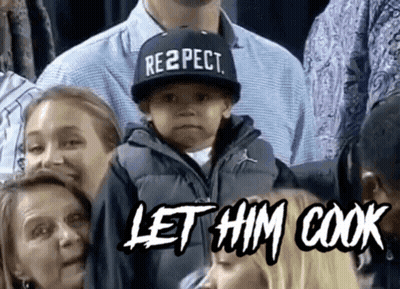 Boy In Respect Hat Sitting In Crowd GIF