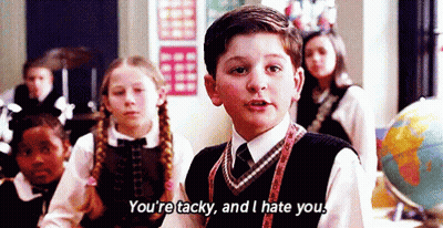 Boy In School Uniform Talking To Children GIF